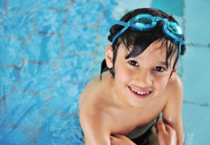 Cute little kid in swimming pool